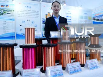 An exhibitor displays enameled wire at the 9th China Advanced Materials Industry Expo 2024 in Qingdao, China, on October 12, 2024. (