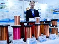 An exhibitor displays enameled wire at the 9th China Advanced Materials Industry Expo 2024 in Qingdao, China, on October 12, 2024. (