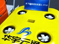 An exhibitor displays an underwater intelligent cleaning robot at the 9th China Advanced Materials Industry Expo 2024 in Qingdao, China, on...