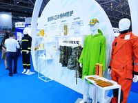 An exhibitor displays special protective clothing at the 9th China Advanced Materials Industry Expo 2024 in Qingdao, China, on October 12, 2...