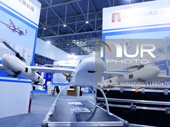 An exhibitor shows a drone at the 9th China Advanced Materials Industry Expo 2024 in Qingdao, China, on October 12, 2024. (