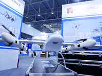 An exhibitor shows a drone at the 9th China Advanced Materials Industry Expo 2024 in Qingdao, China, on October 12, 2024. (