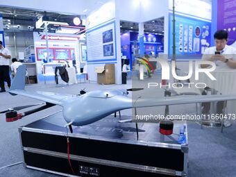 An exhibitor shows a drone at the 9th China Advanced Materials Industry Expo 2024 in Qingdao, China, on October 12, 2024. (