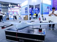 An exhibitor shows a drone at the 9th China Advanced Materials Industry Expo 2024 in Qingdao, China, on October 12, 2024. (