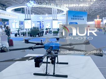 An exhibitor shows a drone at the 9th China Advanced Materials Industry Expo 2024 in Qingdao, China, on October 12, 2024. (