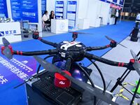 An exhibitor shows a drone at the 9th China Advanced Materials Industry Expo 2024 in Qingdao, China, on October 12, 2024. (