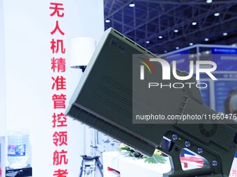 An exhibitor displays a drone control platform at the 9th China Advanced Materials Industry Expo 2024 in Qingdao, China, on October 12, 2024...