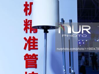 An exhibitor displays a drone control platform at the 9th China Advanced Materials Industry Expo 2024 in Qingdao, China, on October 12, 2024...