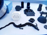 An exhibitor displays new ceramic materials and products at the 9th China Advanced Materials Industry Expo 2024 in Qingdao, China, on Octobe...