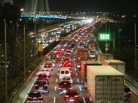 Weekend rush hour traffic occurs on the outer ring highway of Xupu Bridge in Shanghai, China, on October 12, 2024. (