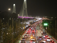 Weekend rush hour traffic occurs on the outer ring highway of Xupu Bridge in Shanghai, China, on October 12, 2024. (