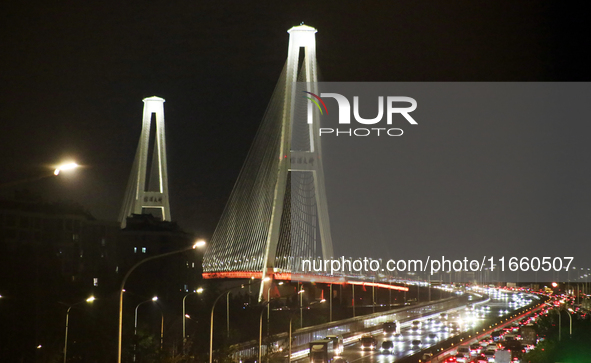 Weekend rush hour traffic occurs on the outer ring highway of Xupu Bridge in Shanghai, China, on October 12, 2024. 