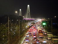 Weekend rush hour traffic occurs on the outer ring highway of Xupu Bridge in Shanghai, China, on October 12, 2024. (