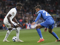 Bukayo Saka of England and Dimitris Giannoulis of Greece are in action during the football game between England and Greece for the UEFA Nati...