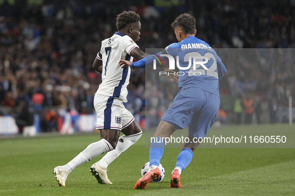 Bukayo Saka of England and Dimitris Giannoulis of Greece are in action during the football game between England and Greece for the UEFA Nati...