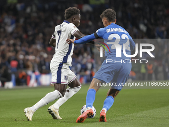 Bukayo Saka of England and Dimitris Giannoulis of Greece are in action during the football game between England and Greece for the UEFA Nati...