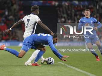 Bukayo Saka of England and Dimitris Giannoulis of Greece are in action during the football game between England and Greece for the UEFA Nati...