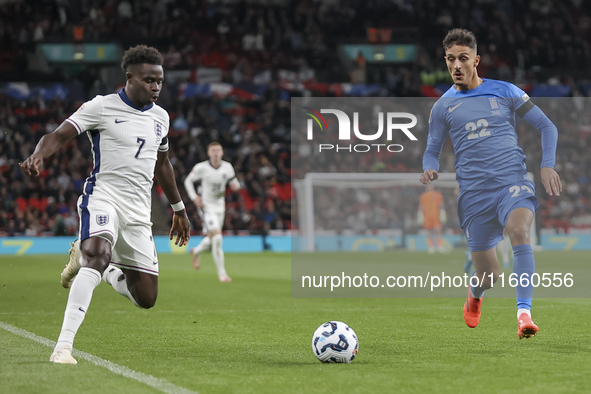 Bukayo Saka of England and Dimitris Giannoulis of Greece are in action during the football game between England and Greece for the UEFA Nati...