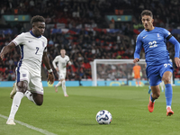 Bukayo Saka of England and Dimitris Giannoulis of Greece are in action during the football game between England and Greece for the UEFA Nati...