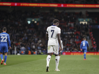 Bukayo Saka of England and Dimitris Giannoulis of Greece participate in the football game between England and Greece for the UEFA Nations Le...