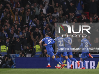 Konstantinos Koulierakis, Dimitris Giannoulis, Vangelis Pavlidis, and Christos Tzolis of Greece celebrate Greece's goal in front of the Gree...