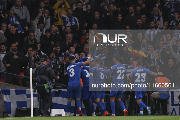 Konstantinos Koulierakis, Dimitris Giannoulis, Vangelis Pavlidis, Manolis Siopis, and Christos Tzolis of Greece celebrate Greece's goal in f...