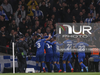 Konstantinos Koulierakis, Dimitris Giannoulis, Vangelis Pavlidis, Manolis Siopis, and Christos Tzolis of Greece celebrate Greece's goal in f...