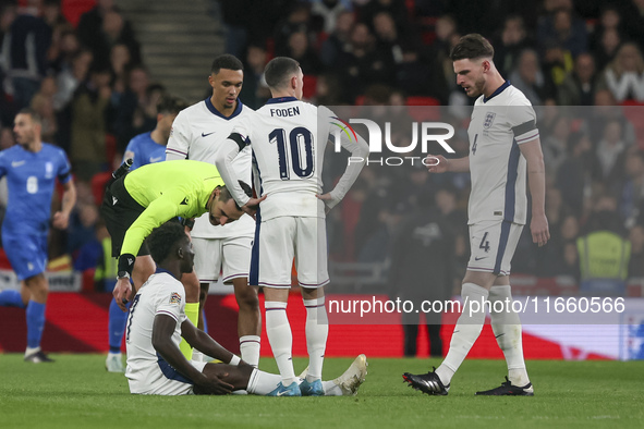 Bukayo Saka of England is on the ground during the football game between England and Greece for the UEFA Nations League 2024/25 League B Gro...