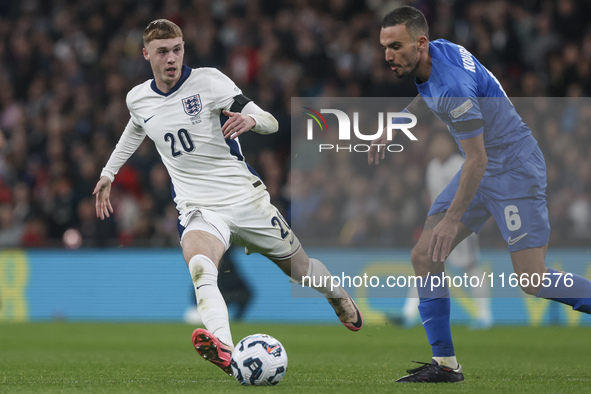 Cole Palmer of England and Dimitris Kourbelis of Greece play during the football game between England and Greece for the UEFA Nations League...