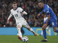 Cole Palmer of England and Dimitris Kourbelis of Greece play during the football game between England and Greece for the UEFA Nations League...