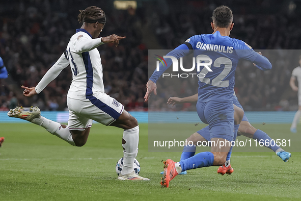 Noni Madueke of England kicks the ball next to Dimitris Giannoulis of Greece during the football game between England and Greece for the UEF...