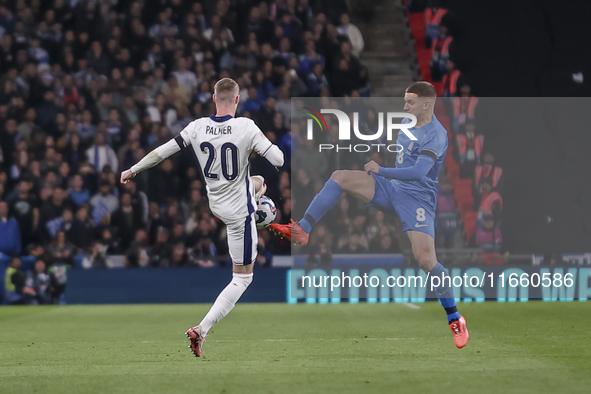 Cole Palmer of England and Christos Tzolis of Greece compete in the air for the ball during the football game between England and Greece for...