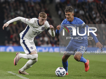 Cole Palmer of England and Dimitris Giannoulis of Greece play during the football game between England and Greece for the UEFA Nations Leagu...