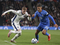 Cole Palmer of England and Dimitris Giannoulis of Greece play during the football game between England and Greece for the UEFA Nations Leagu...