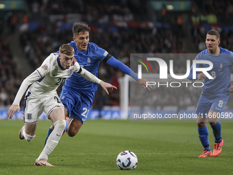 Cole Palmer of England and Dimitris Giannoulis of Greece are in action while Christos Tzolis of Greece reaches during the football game betw...