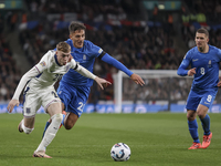 Cole Palmer of England and Dimitris Giannoulis of Greece are in action while Christos Tzolis of Greece reaches during the football game betw...