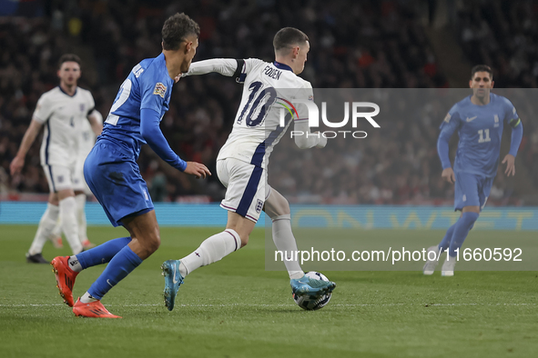 Phil Foden of England and Dimitris Giannoulis of Greece play during the football game between England and Greece for the UEFA Nations League...