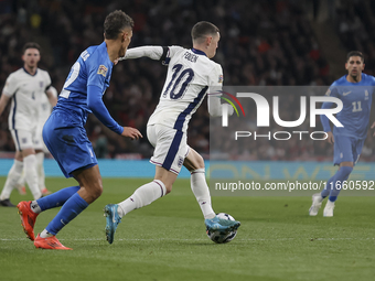 Phil Foden of England and Dimitris Giannoulis of Greece play during the football game between England and Greece for the UEFA Nations League...