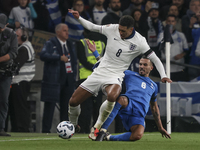 Jude Bellingham of England and Christos Tzolis of Greece are in action during the football game between England and Greece for the UEFA Nati...