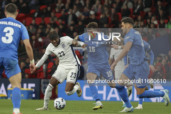 Noni Madueke of England, Lazaros Rota, and Ntinos Mavropanos of Greece participate in the football game between England and Greece for the U...