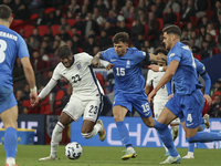 Noni Madueke of England, Lazaros Rota, and Ntinos Mavropanos of Greece participate in the football game between England and Greece for the U...