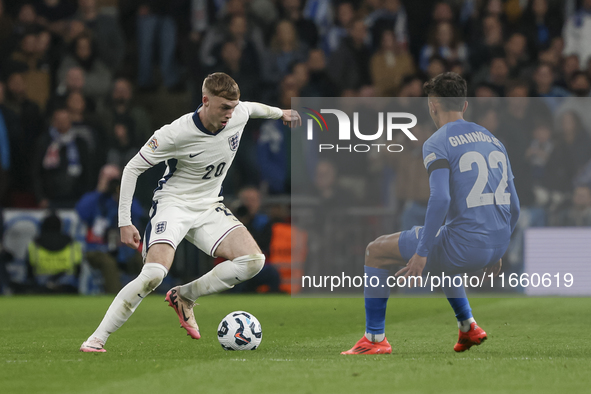 Cole Palmer of England has the ball, and Dimitris Giannoulis of Greece is in action during the football game between England and Greece for...