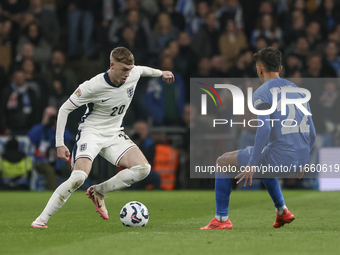 Cole Palmer of England has the ball, and Dimitris Giannoulis of Greece is in action during the football game between England and Greece for...