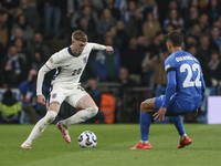 Cole Palmer of England has the ball, and Dimitris Giannoulis of Greece is in action during the football game between England and Greece for...