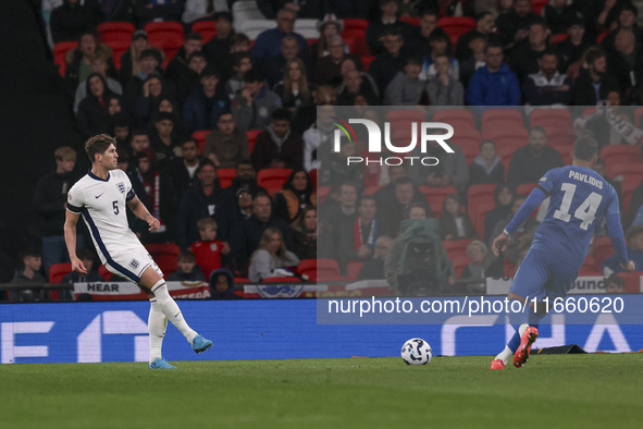 John Stones of England and Vangelis Pavlidis of Greece participate in the football game between England and Greece for the UEFA Nations Leag...