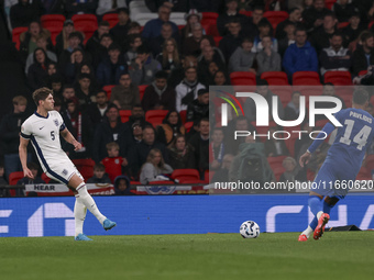 John Stones of England and Vangelis Pavlidis of Greece participate in the football game between England and Greece for the UEFA Nations Leag...