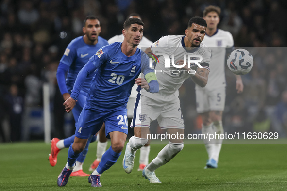 Petros Mantalos of Greece and Dominic Solanke of England run for the ball during the football game between England and Greece for the UEFA N...