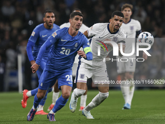 Petros Mantalos of Greece and Dominic Solanke of England run for the ball during the football game between England and Greece for the UEFA N...