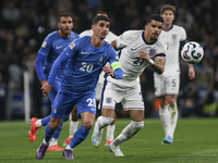 Petros Mantalos of Greece and Dominic Solanke of England run for the ball during the football game between England and Greece for the UEFA N...