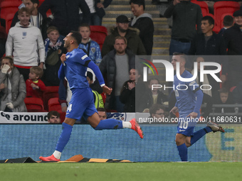 Vangelis Pavlidis of Greece celebrates his goal, followed by Dimitris Pelkas, during the football game between England and Greece for the UE...